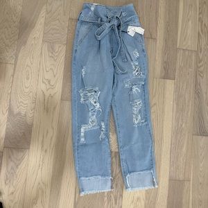 Distressed mid rise jeans
